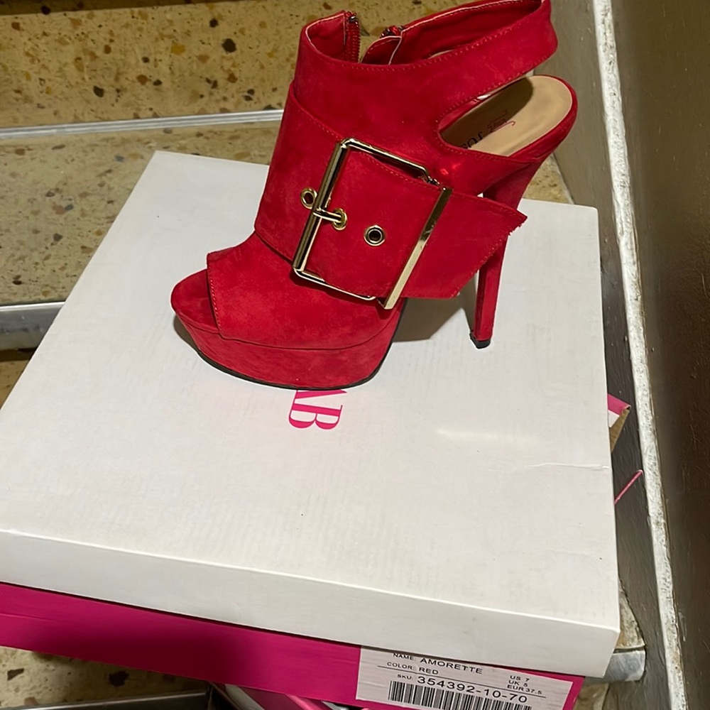 Slightly used red big buckle heels